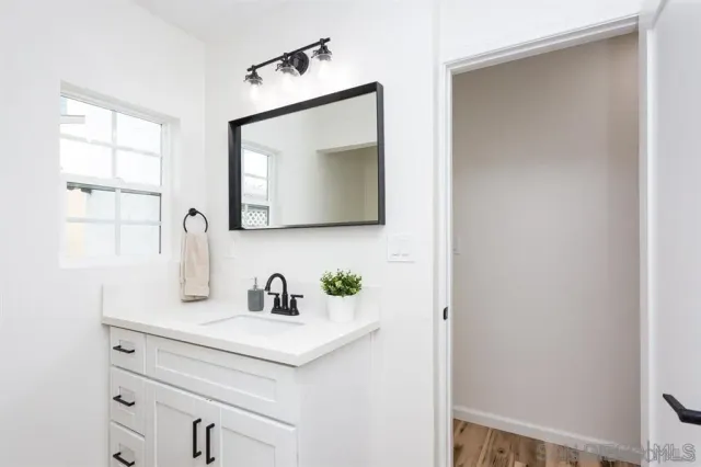 a bathroom with a sink and a mirror