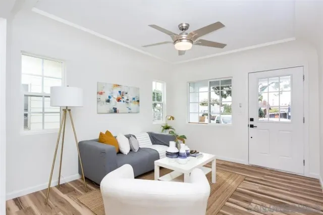 a living room with furniture and a large window