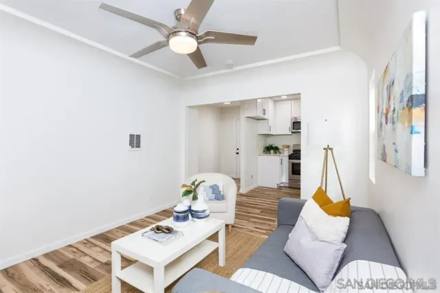 a living room with furniture and a table