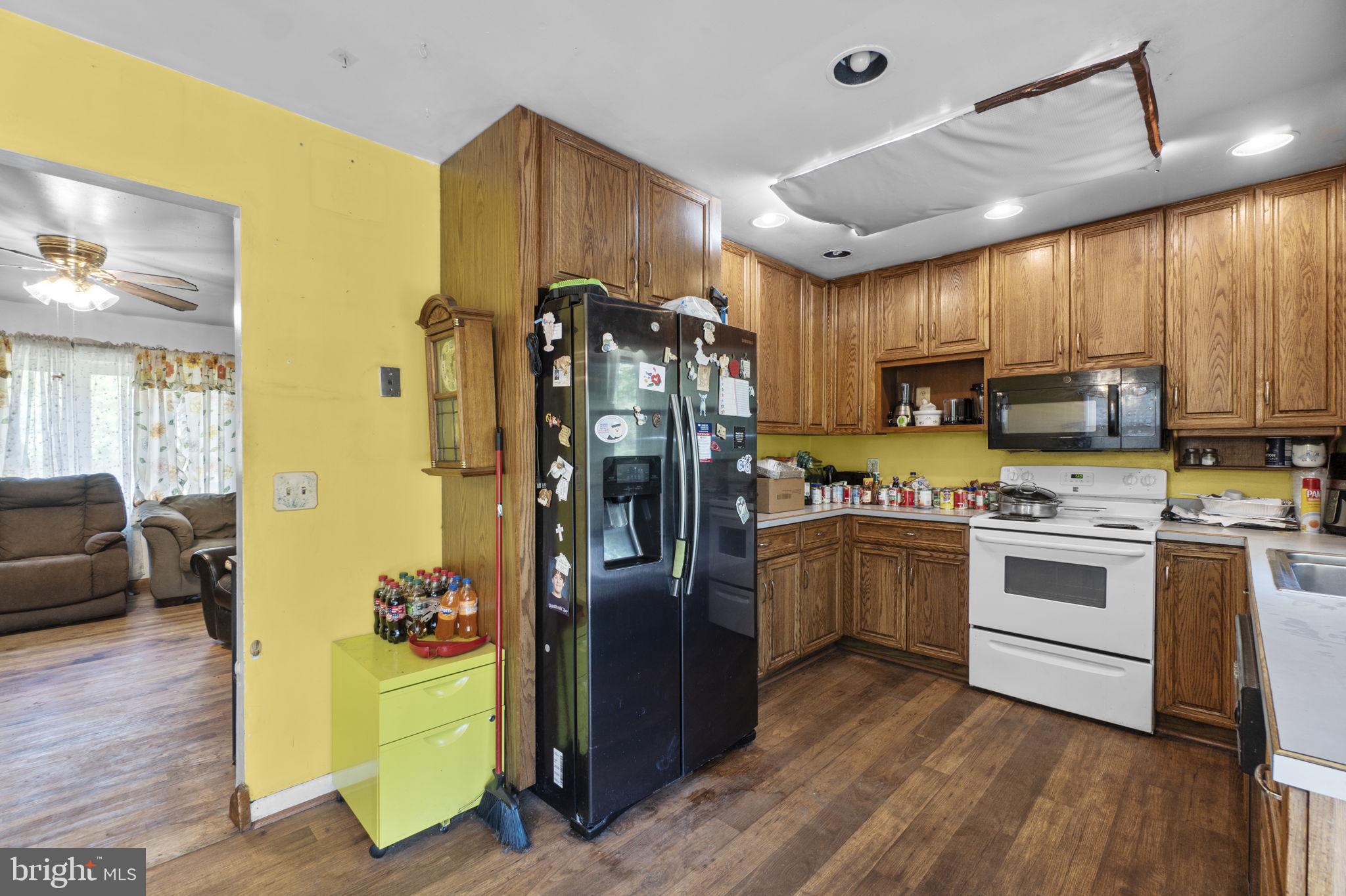 6403 Ford Road Frederick, MD 21702 - Photo 5 of 19 a kitchen with a refrigerator cabinets and a sink