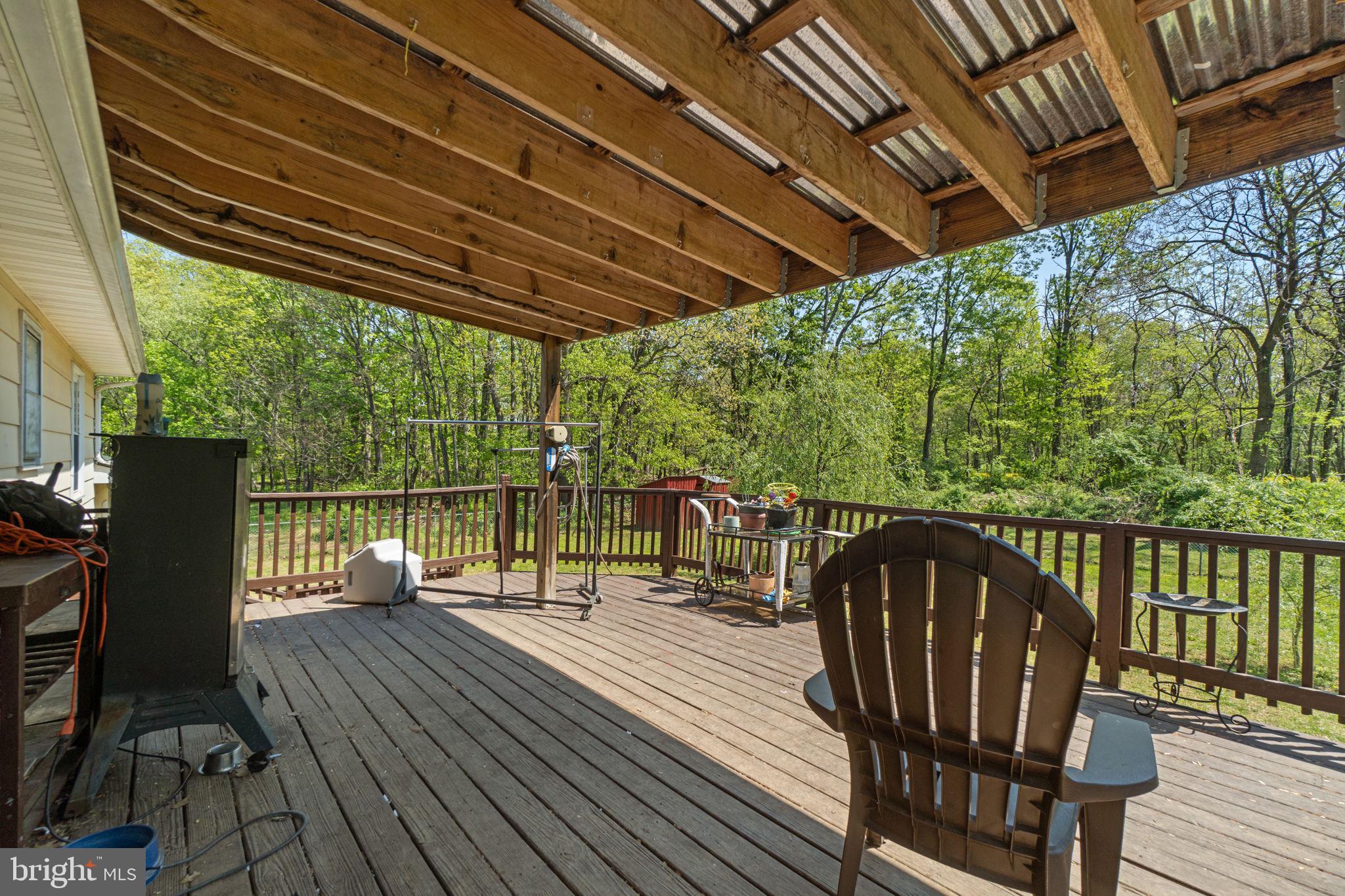 6403 Ford Road Frederick, MD 21702 - Photo 7 of 19 a view of balcony with wooden floor and outdoor seating