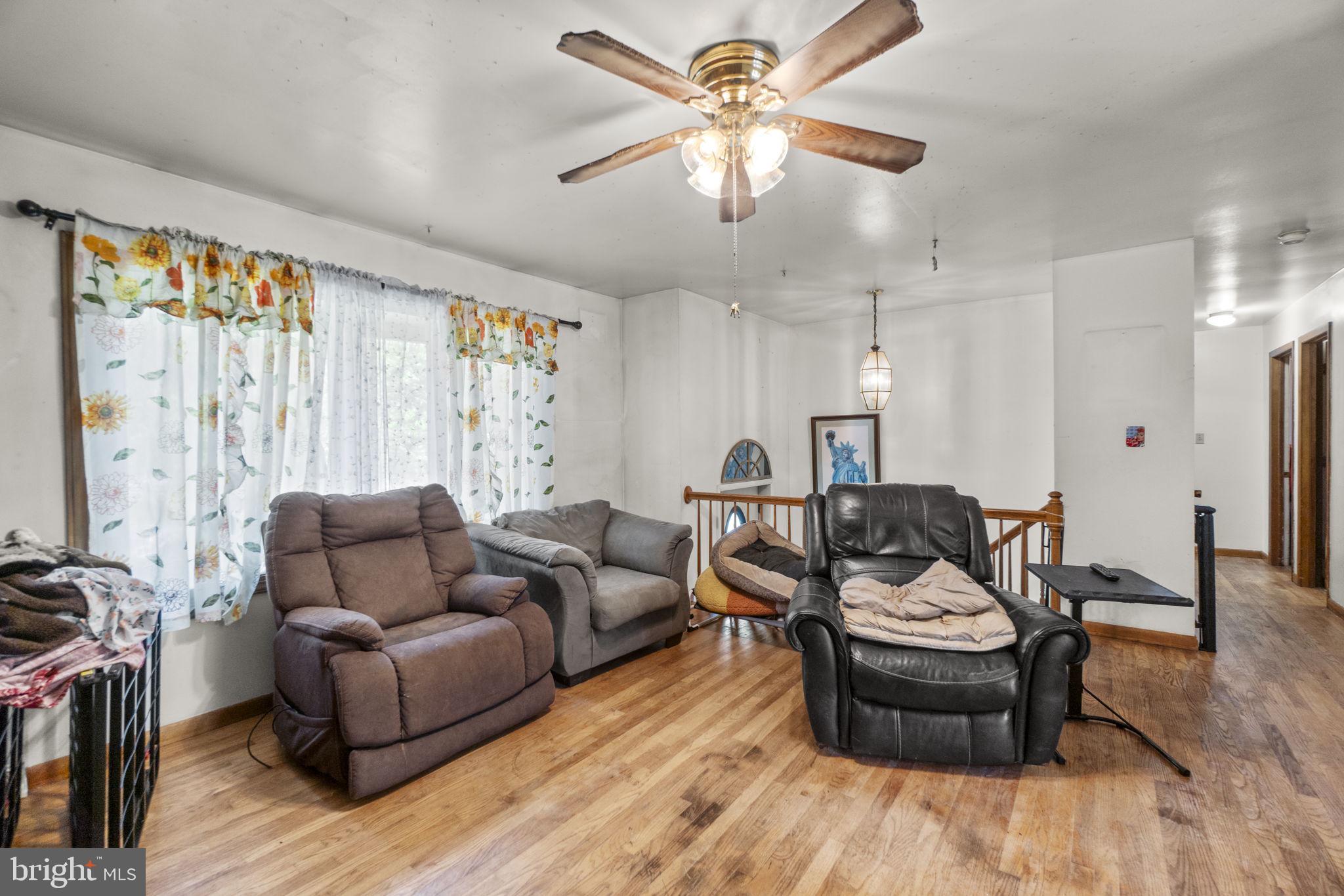 6403 Ford Road Frederick, MD 21702 - Photo 8 of 19 a living room with furniture and a wooden floor