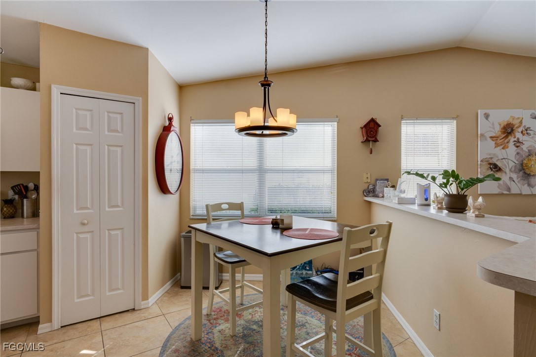 10741 Rio Mar Circle Estero, FL 33928 - Photo 11 of 23 a dining room with furniture and window