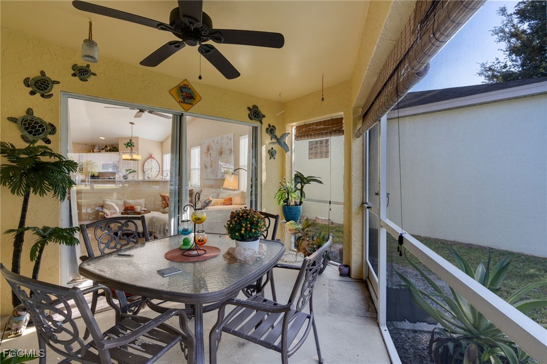 10741 Rio Mar Circle Estero, FL 33928 - Photo 15 of 23 a view of a dining room with furniture and a potted plant
