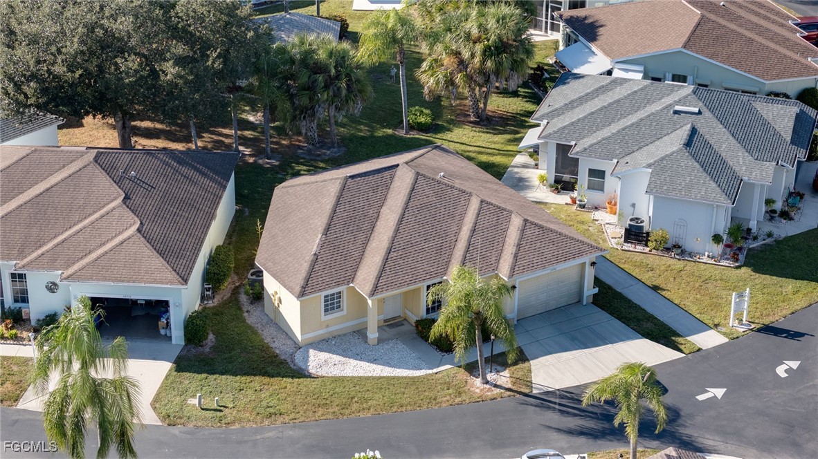 10741 Rio Mar Circle Estero, FL 33928 - Photo 20 of 23 an aerial view of a house with garden and plants