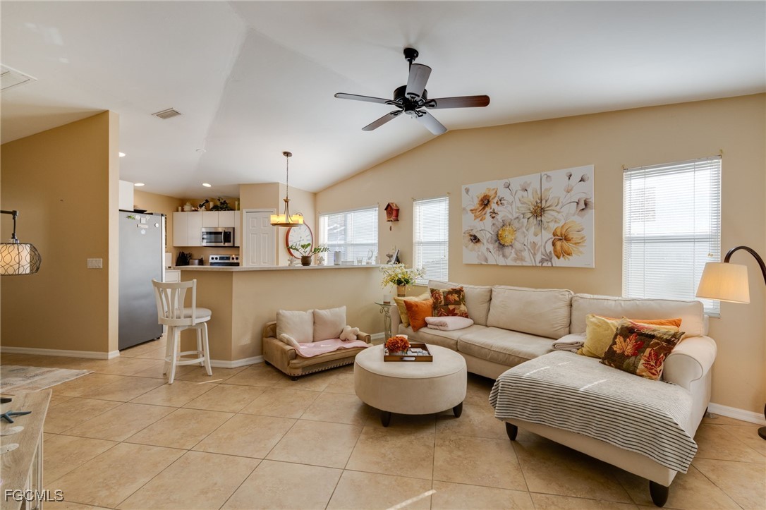 10741 Rio Mar Circle Estero, FL 33928 - Photo 4 of 23 a living room with furniture and a large window