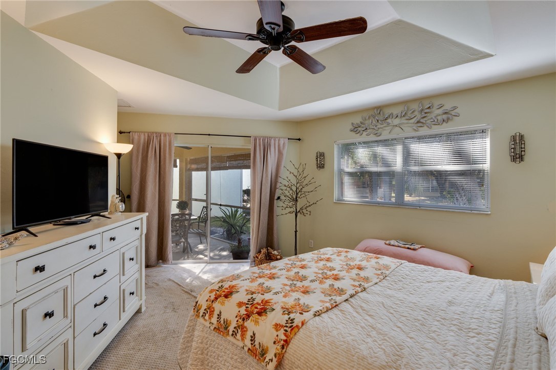 10741 Rio Mar Circle Estero, FL 33928 - Photo 9 of 23 a bedroom with furniture and flat screen tv