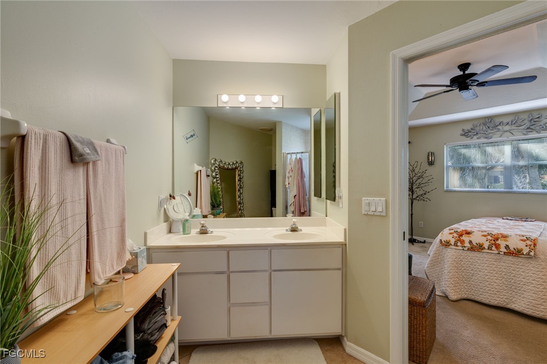 10741 Rio Mar Circle Estero, FL 33928 - Photo 10 of 23 a bathroom with a double vanity sink mirror and shower