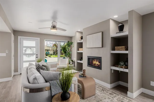 a living room with furniture and a fireplace