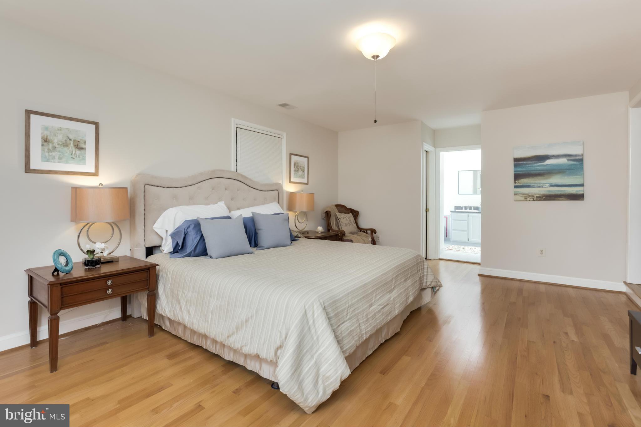 4508 19th Road North Arlington, VA 22207 - Photo 12 of 30 a bedroom with a bed and wooden floor