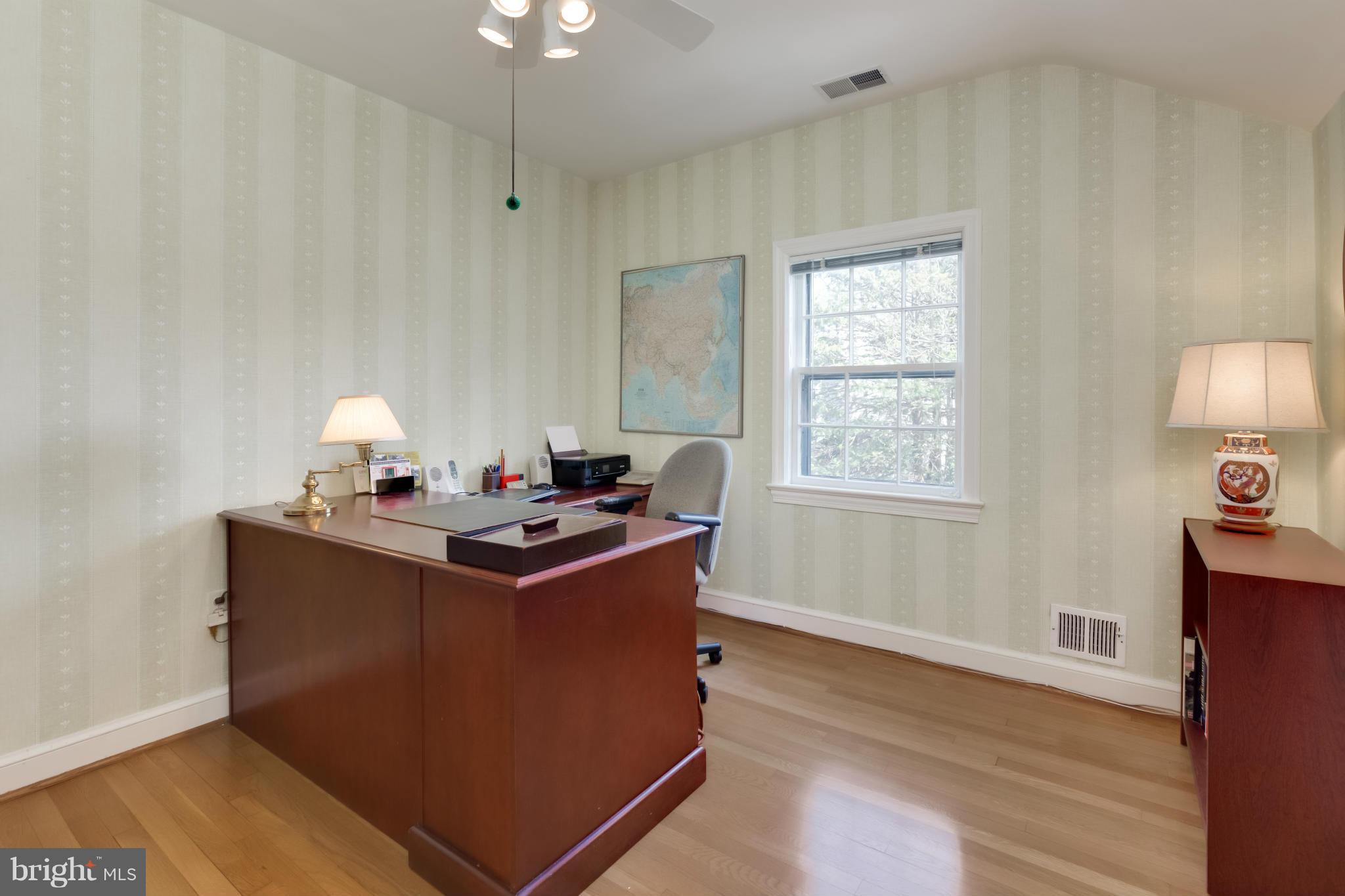 4508 19th Road North Arlington, VA 22207 - Photo 17 of 30 a room with kitchen island stainless steel appliances a sink window and wooden floor