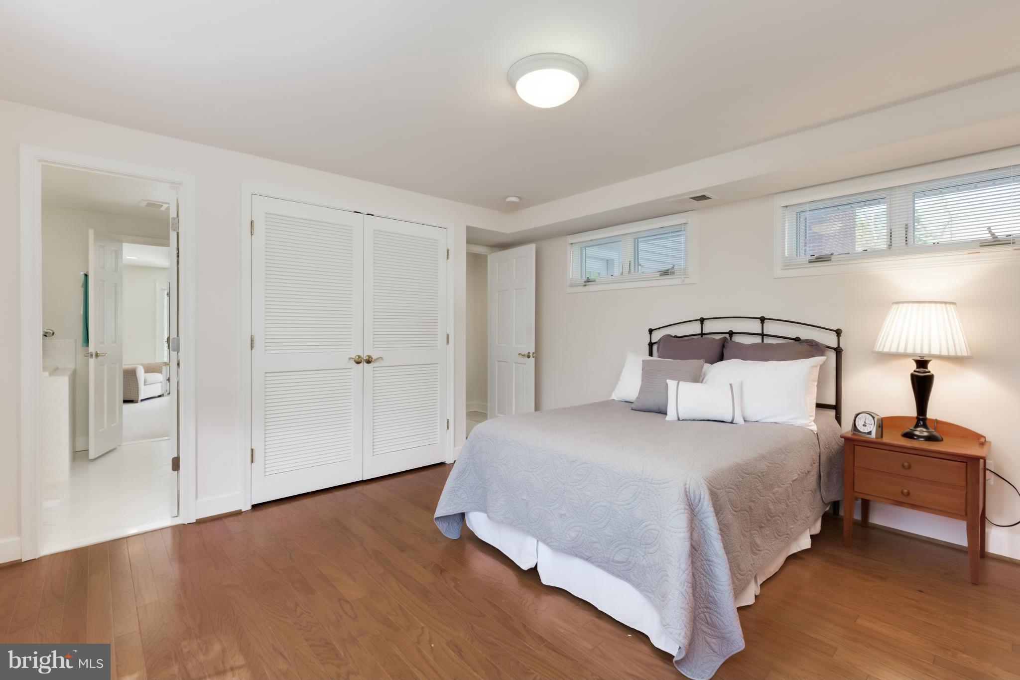 4508 19th Road North Arlington, VA 22207 - Photo 22 of 30 a bedroom with a bed and a lamp