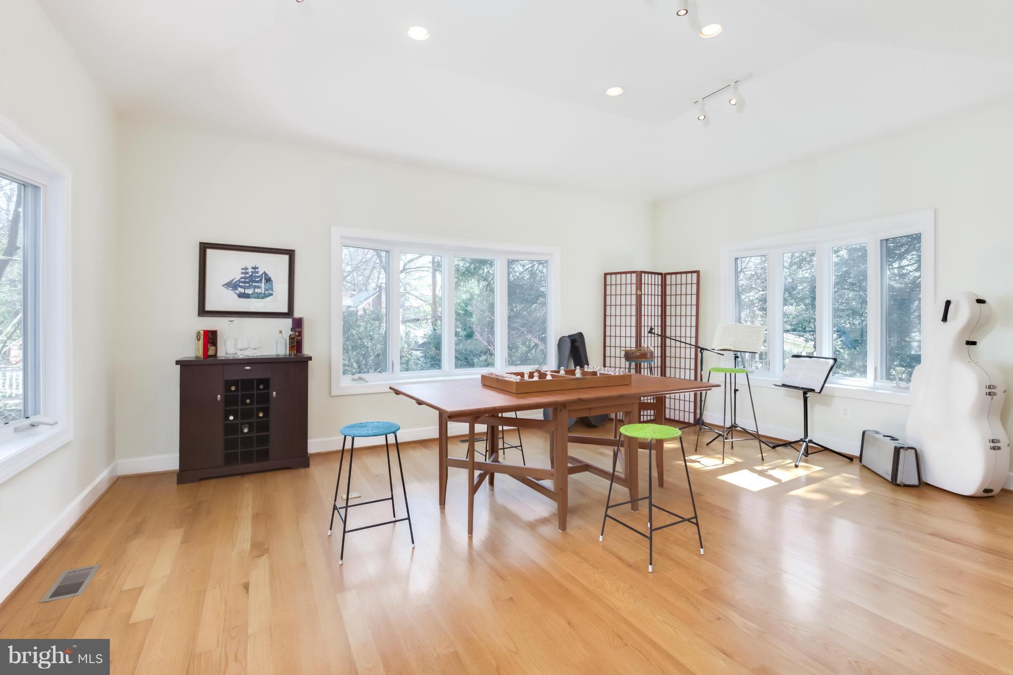 4508 19th Road North Arlington, VA 22207 - Photo 8 of 30 a living room with furniture a dining table and wooden floor