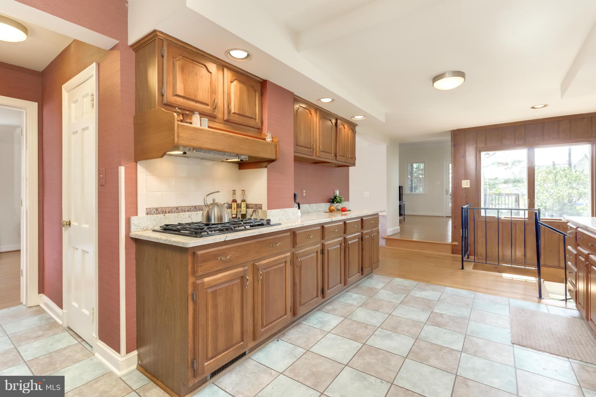 4508 19th Road North Arlington, VA 22207 - Photo 10 of 30 a kitchen with stainless steel appliances granite countertop a stove a sink and a refrigerator