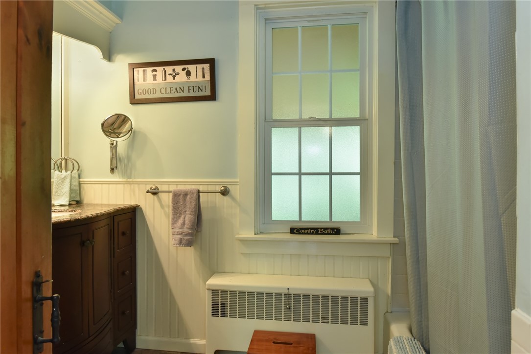31 South Killingly Road Foster, RI 02825 - Photo 29 of 41 Bathroom on first floor with tiled tub and shower.
