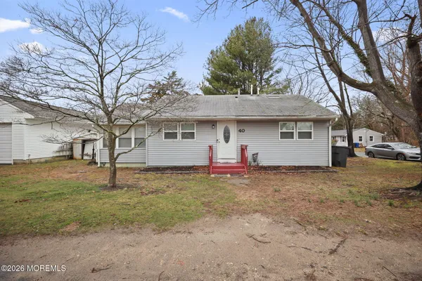 a view of a house with a yard and garage