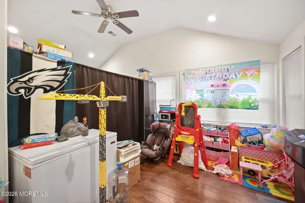 a room with furniture and musical instruments
