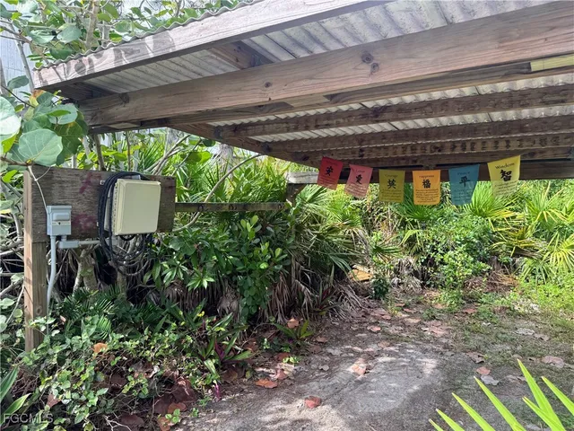 a view of a chair and table in the backyard