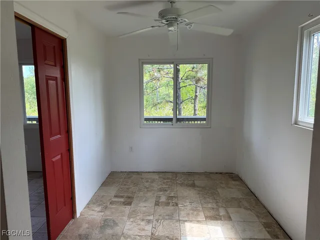 an empty room with windows