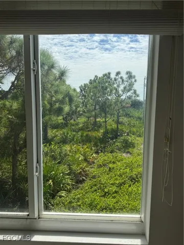 a view of a glass door and a window