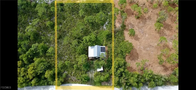 a view of a garden with a building