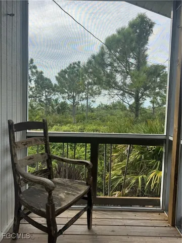 a view of a balcony with wooden floor