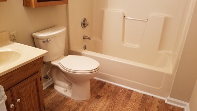 2913 Graham Road Gray, GA 31032 - Photo 14 of 18 a white toilet sitting next to a bath tub
