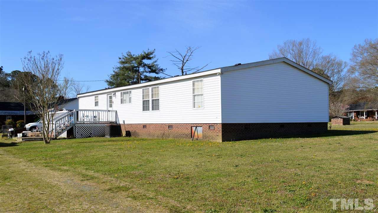 8701 Walter Myatt Road Willow Spring, NC 27592 - Photo 12 of 13 a view of a house with a yard