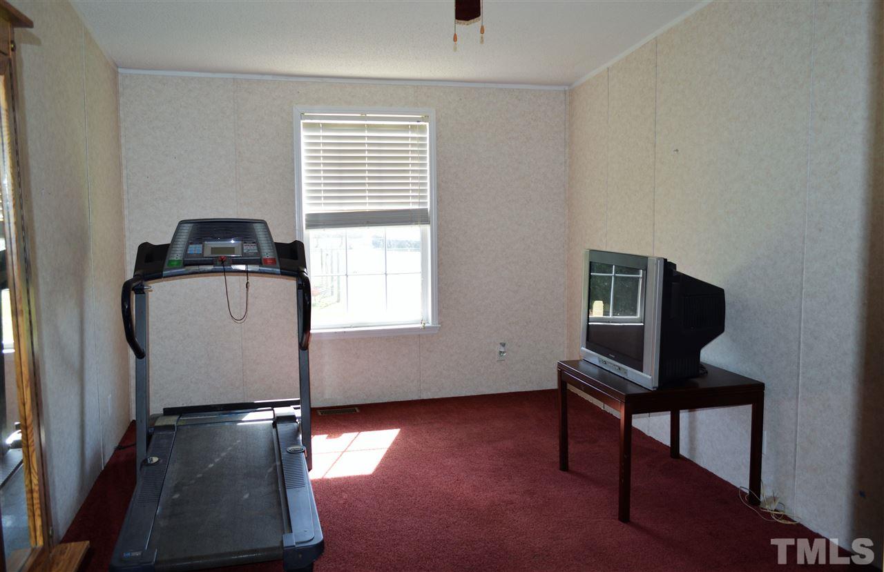 8701 Walter Myatt Road Willow Spring, NC 27592 - Photo 10 of 13 a room with a window