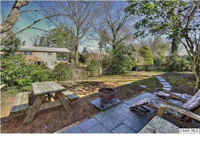 1407 Rutledge Avenue Charlottesville, VA 22903 - Photo 20 of 24 Kick back and relax soaking in sunshine and fresh air on the slate patio. When the trees leaf out, this yard becomes a private retreat.