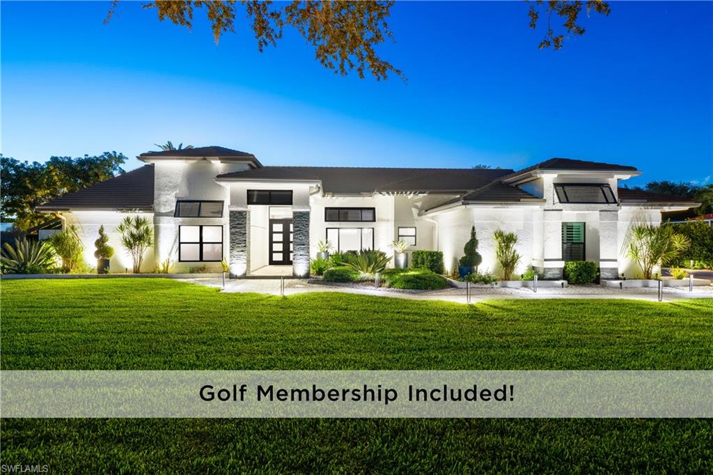 19559 Vintage Trace Circle Estero, FL 33967 - Photo 1 of 50 a view of a big house with a big yard