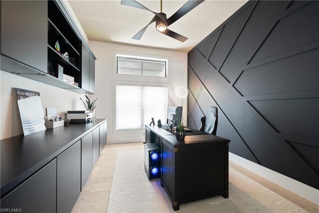 19559 Vintage Trace Circle Estero, FL 33967 - Photo 40 of 50 a kitchen with stainless steel appliances granite countertop a sink a stove and a refrigerator