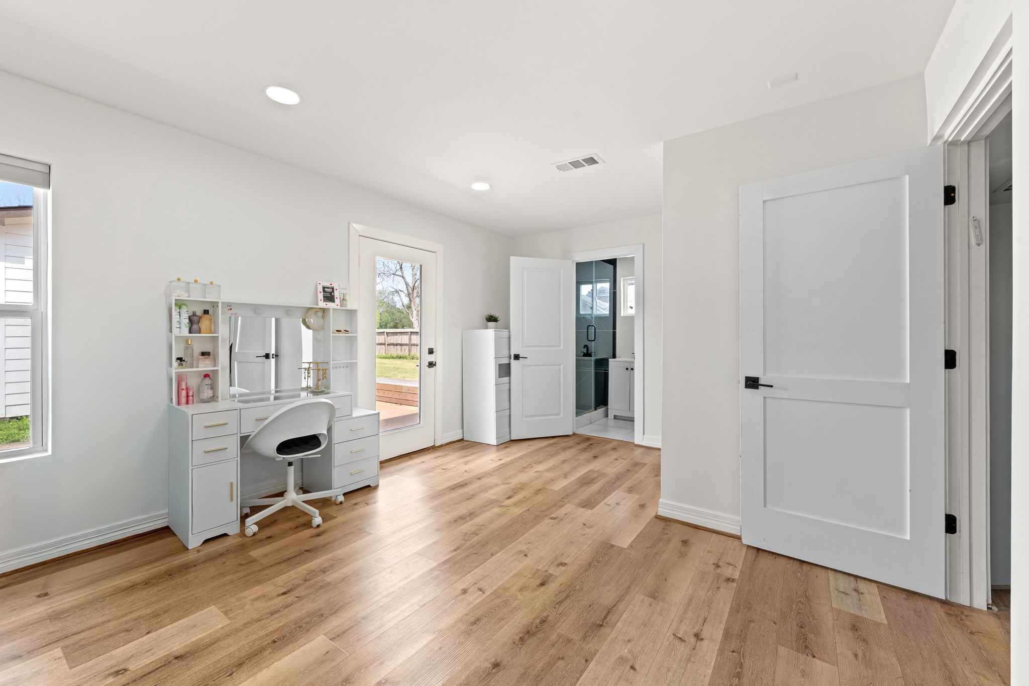 8800 Brae Acres Road Houston, TX 77074 - Photo 31 of 48 a view of an empty room with wooden floor and a window