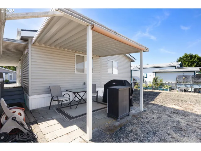 a view of a backyard and a patio