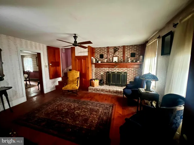 a living room with furniture rug and window
