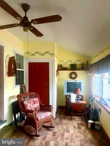 a living room with furniture and a rug
