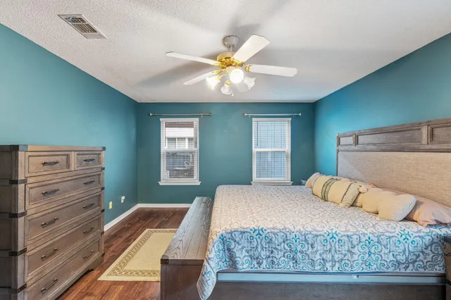 a view of walk in closet with clothes