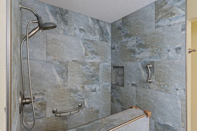 a bathroom with a sink a toilet and shower curtain