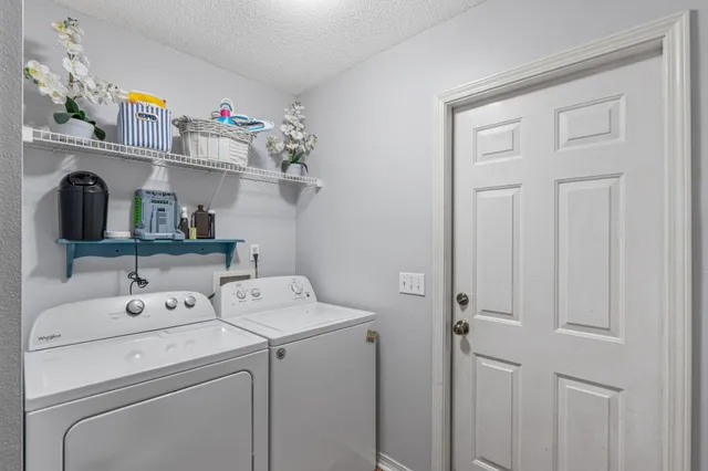 a view of a patio with wooden floor