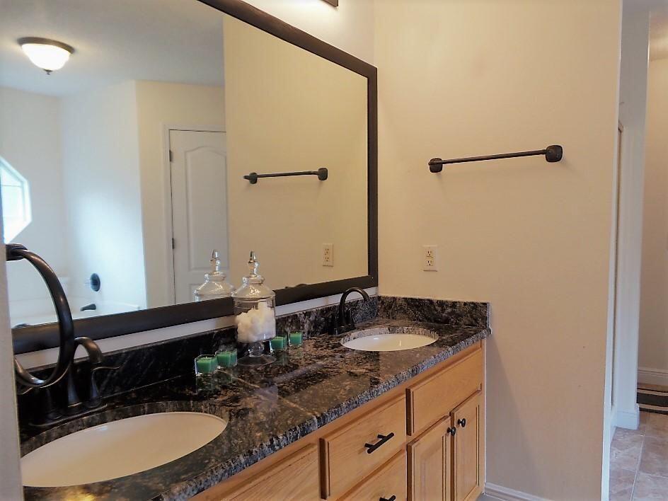 211 Foxchase Way Crestview, FL 32536 - Photo 15 of 24 a bathroom with a sink and a mirror