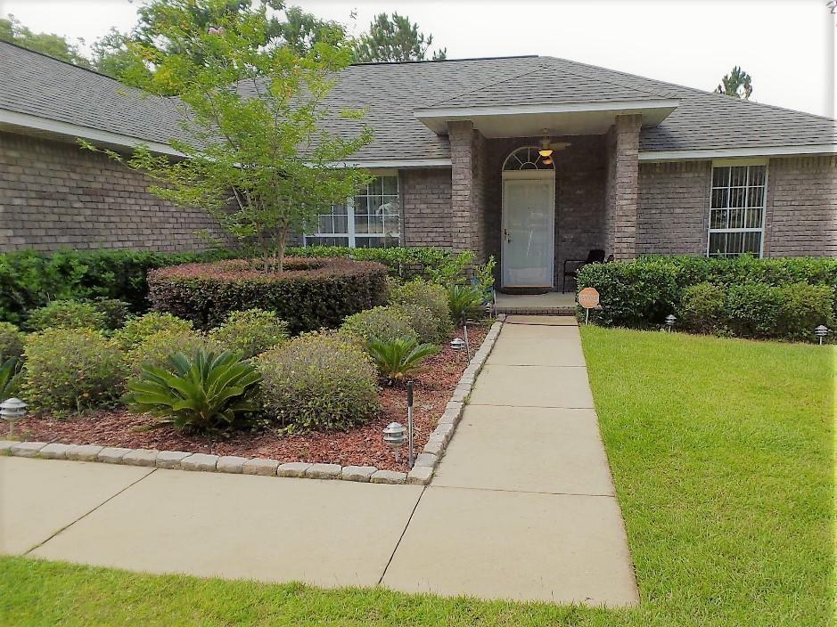 211 Foxchase Way Crestview, FL 32536 - Photo 2 of 24 a front view of a house with a yard