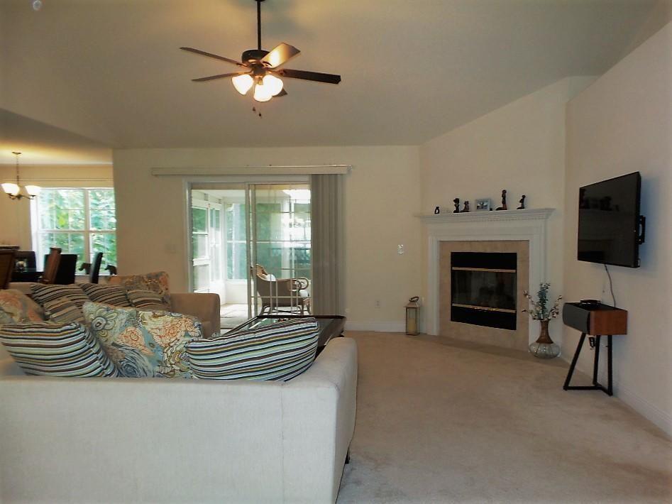 211 Foxchase Way Crestview, FL 32536 - Photo 4 of 24 a living room with furniture and a fireplace