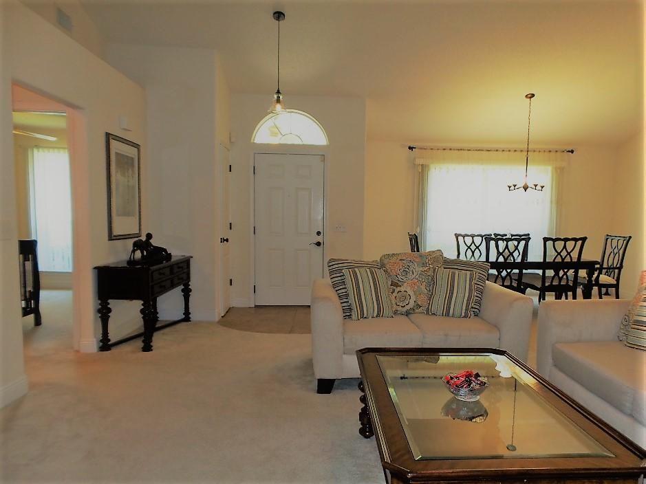 211 Foxchase Way Crestview, FL 32536 - Photo 6 of 24 a living room with furniture and a wooden floor