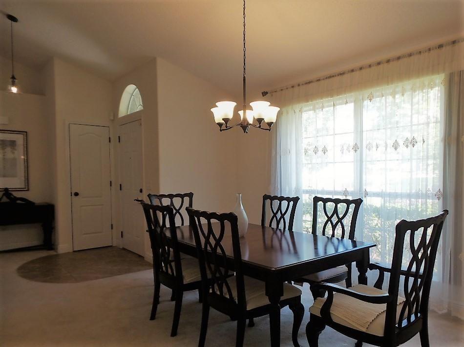 211 Foxchase Way Crestview, FL 32536 - Photo 8 of 24 a view of a dining room with furniture window and outside view