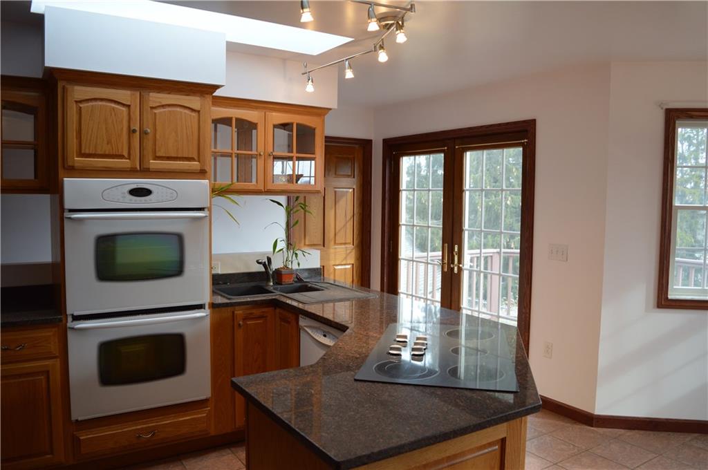 783 West Old Rte 422 Butler, PA 16001 - Photo 8 of 25 Kitchen View From Pantry to Swinging door for dining room and double doors to Rear Deck