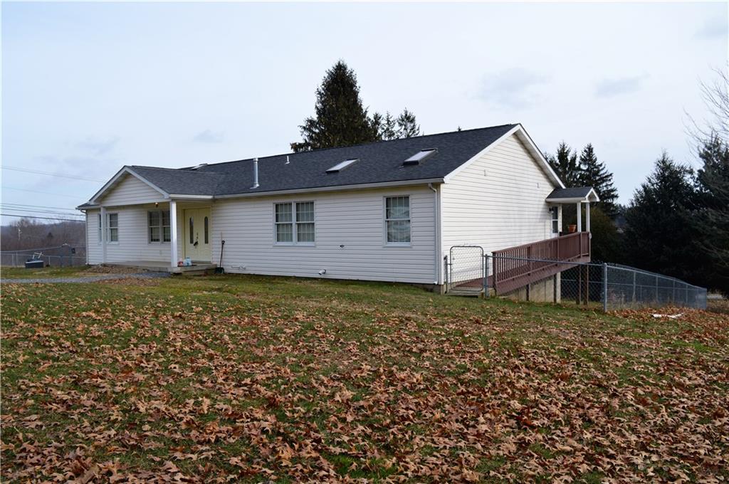 783 West Old Rte 422 Butler, PA 16001 - Photo 10 of 25 Side view of home with walk way from door on side of home