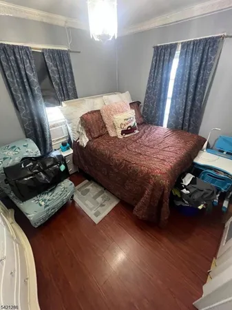 a room with gym equipment and a rug