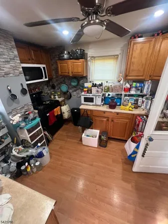 a room with lots of furniture and clutter
