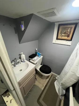 a bedroom with bed and a dresser