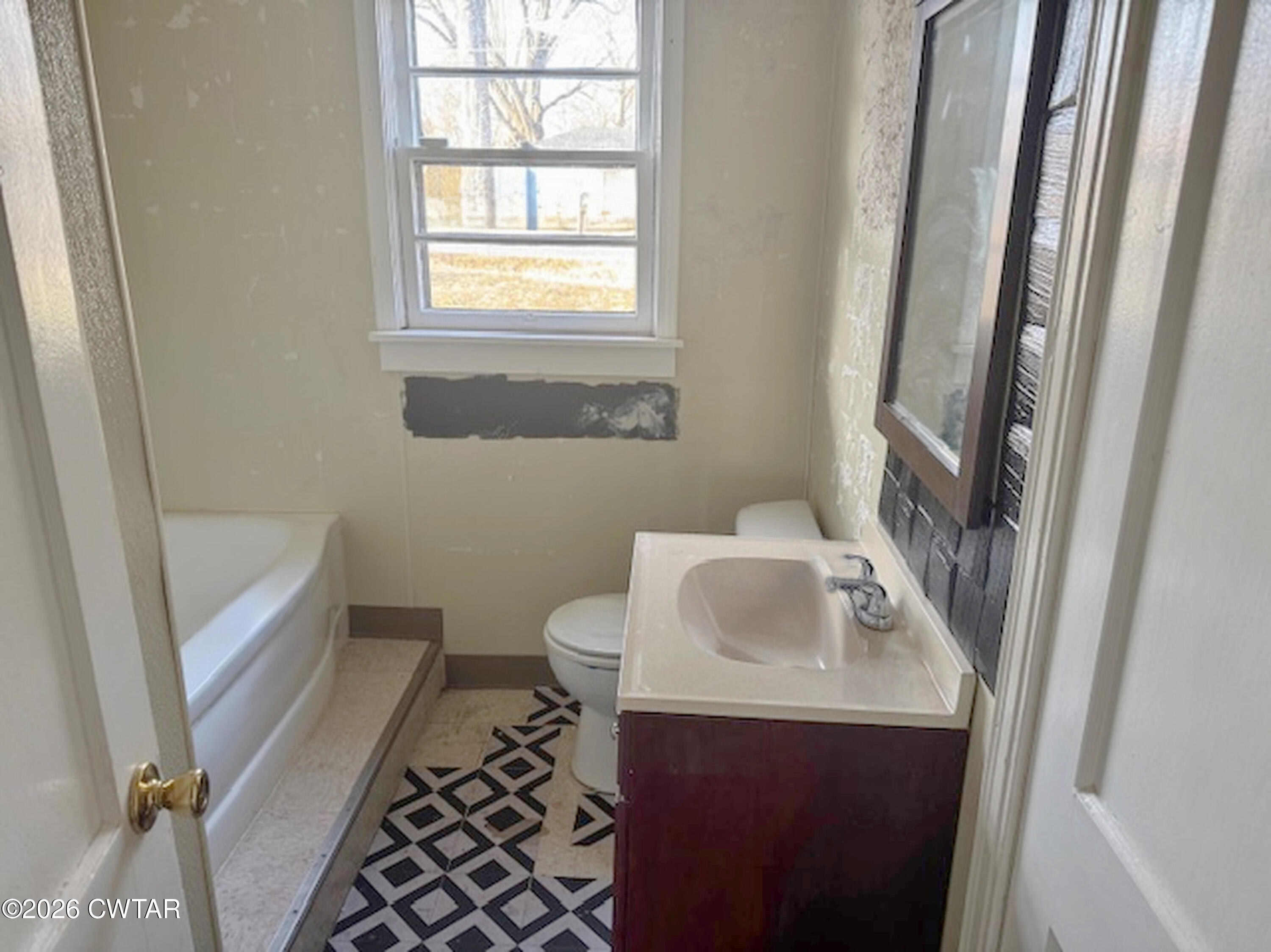 3043 Culpepper Saint Extension Milan, TN 38358 - Photo 8 of 8 a bathroom with a sink toilet and tub